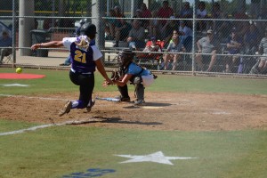 Savannah Mauch makes a force out at home plate against Alexandra LA Photo by Bruce Branum    